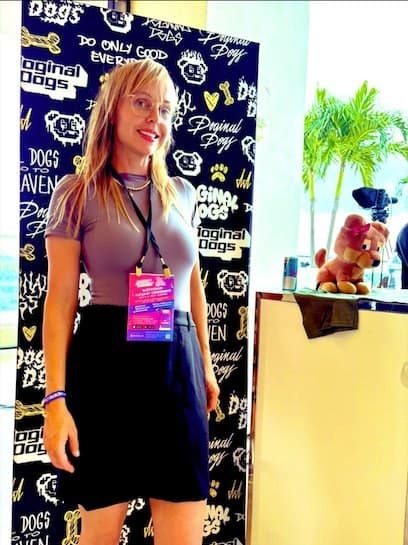 Leah Bluewater at a Doginal Dogs conference Leah Bluewater (@leahbluewater) in front of a Doginal Dogs backdrop